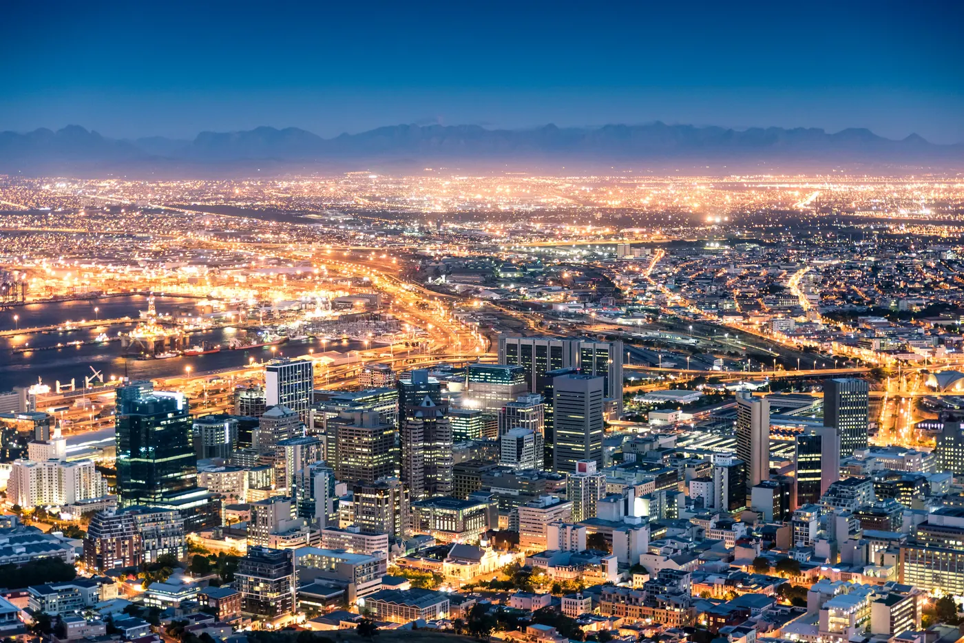 Cape Town city bowl from Signal Hill at blue hour, city lights and mountains