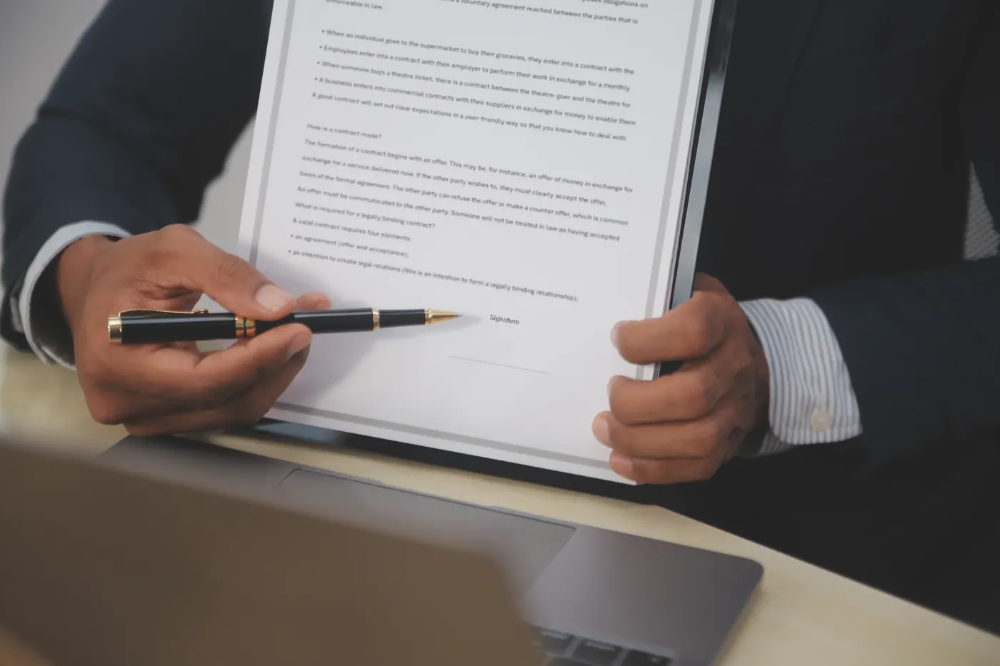 Professional presenting a signed certificate