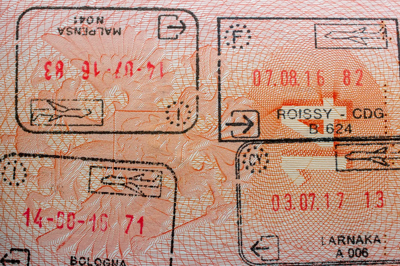 Entry and exit stamps in a passport