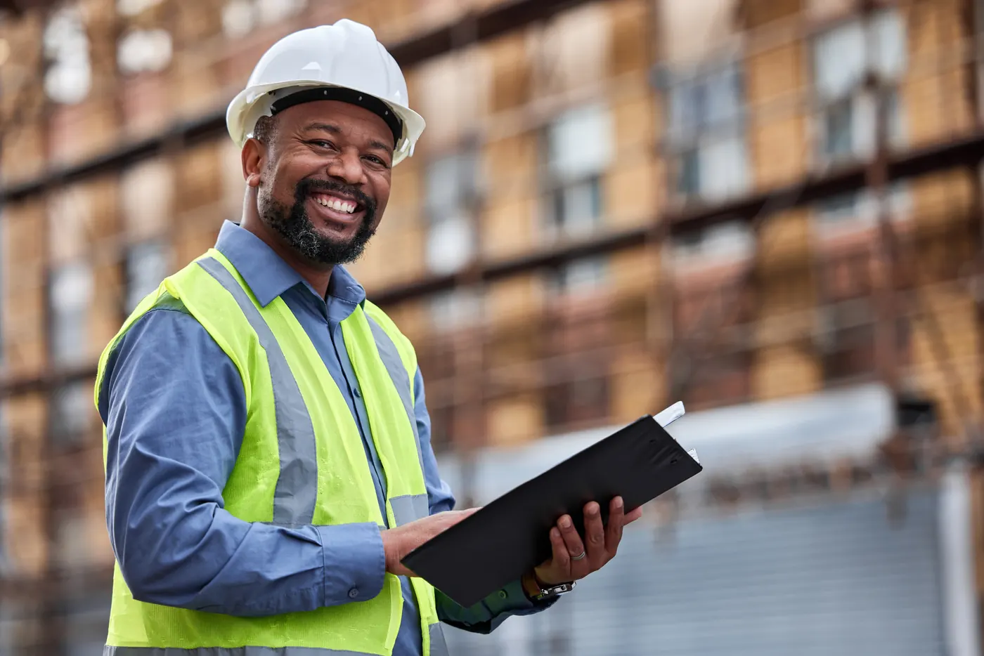 Architect with a tablet on a city building site