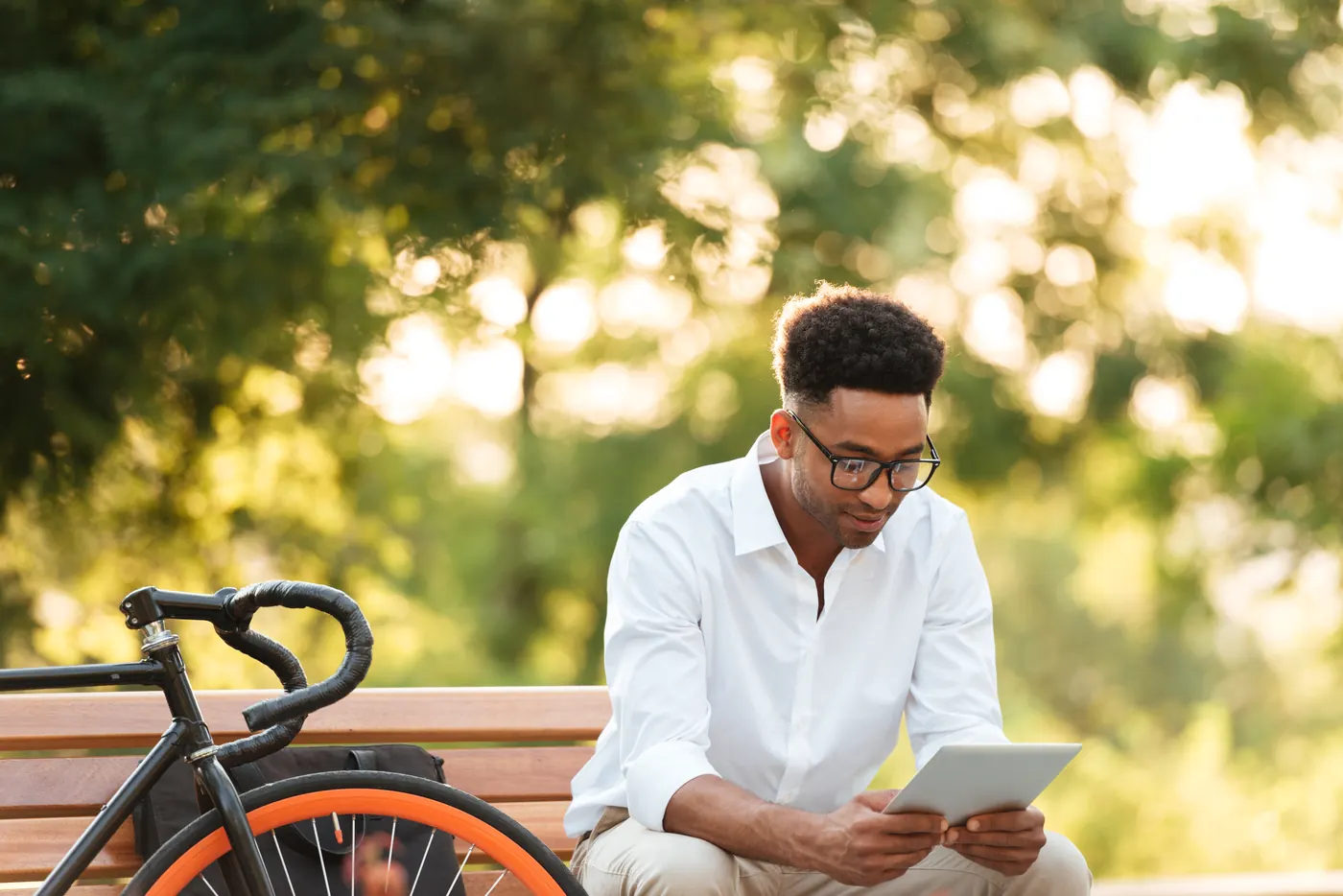 Handsome young african man using tablet computer