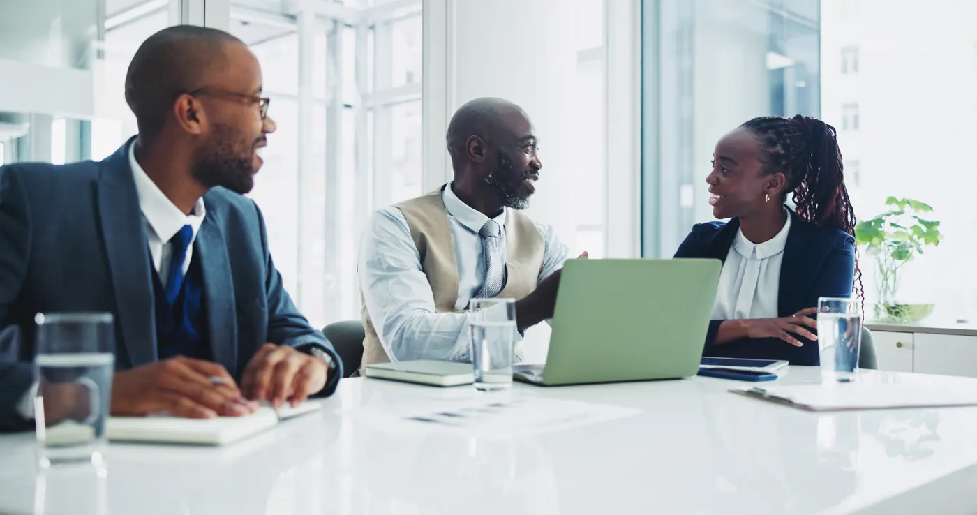 People lawyer and talking for negotiation in boardroom with clients for advice, consultation; advocate and attorney in modern office at law firm