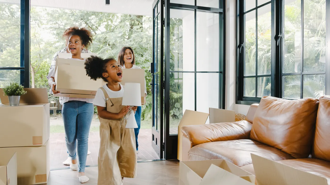 Happy African American young family bought new house